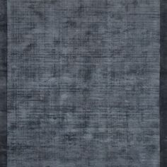 an area rug with dark gray colors