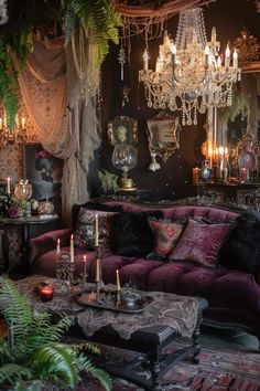 a living room filled with furniture and lots of candles on top of each other in front of a chandelier