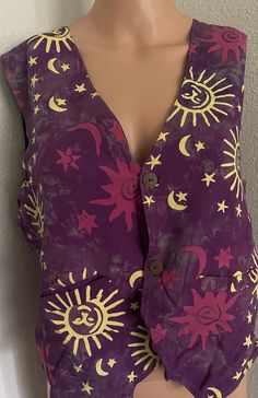 Bliss brand, made in Indonesia. Purple and yellow hand painted batik vest. Two wooden functional buttons on the front. Two pockets  in the front! %100 rayon. Available in size small. Original tags still attached. Vintage but new! New/old store inventory. Never worn, not preowned. Purple Vest Outfits For Women, Hippie Sleeveless Cotton Vest, Sleeveless Festival Vest With Pockets, Casual Festival Vest With Pockets, Sleeveless Vest With Pockets For Festivals, Bohemian Cotton Vest For Vacation, Purple Yellow Outfit, Purple Vest, Vest Outfits For Women