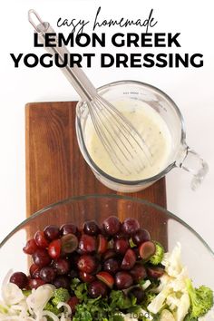 the ingredients for lemon greek yogurt dressing in a glass bowl on a cutting board