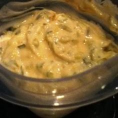 a bowl filled with food sitting on top of a stove