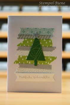 a card with a green christmas tree on it