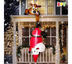 an inflatable christmas decoration with a reindeer and santa clause on it's head