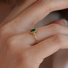 Beautifully crafted 14-karat solid gold ring, designed with a 2.00 mm twisted band that elegantly displays a vibrant 0.30 carat emerald alongside a sparkling 0.04 carat diamond. This exquisite ring is a perfect choice for those who adore emeralds, making it an ideal proposal ring. Material: 14-karat solid gold Gemstones: Central 0.30 carat emerald and a 0.04 carat diamond Band Width: 2.00 mm, providing a delicate yet distinctive appearance Design: Elegant twisted band that enhances the gemstones Ideal For: Proposals, especially for emerald enthusiasts, or as a cherished gift Packaging: Comes with a luxurious gift box Elegant 14k Gold Emerald Ring With Diamond, Elegant Emerald Ring With Single Diamond In 14k Gold, Fine Jewelry Polished Emerald Ring, Modern Polished Emerald Ring For Gift, Luxury Polished Emerald Ring, Elegant Style, Elegant Rings, Solid Gold Ring, Twisted Band, Ringe Gold