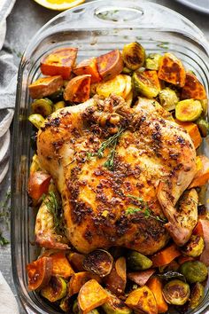 a roasting pan filled with chicken and vegetables