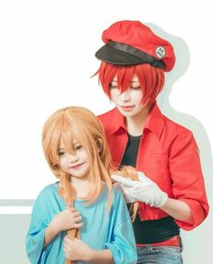 two people with red hair and one is cutting another person's hair in front of a white background