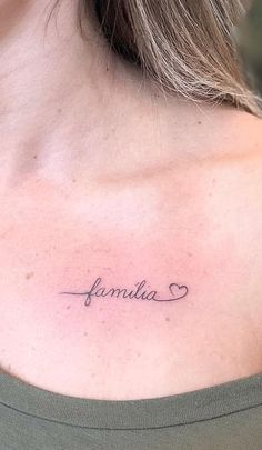 a woman with a tattoo on her shoulder that reads,'fumilia '