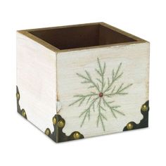 a wooden box with a green and white design on the front, sitting against a white background