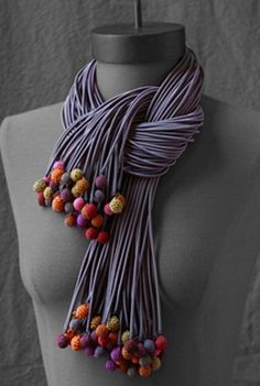 an image of a woman wearing a purple scarf with beads on her neck and the words diy t - shirt strips & polymer clay balls on it