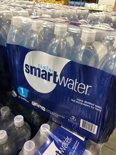 bottled water is on display in a grocery store for $ 1 99 per gallon each