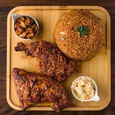 a wooden tray topped with different types of food