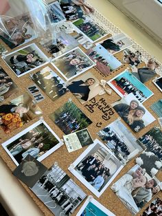 a cork board covered in pictures and photos