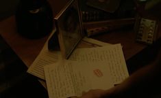 an open book on top of a wooden table