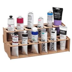 a wooden box with many different types of paint