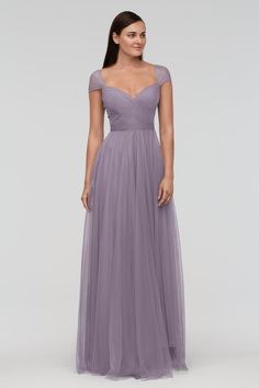 a woman in a long purple dress