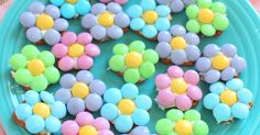 cupcakes with colorful frosting on a blue plate