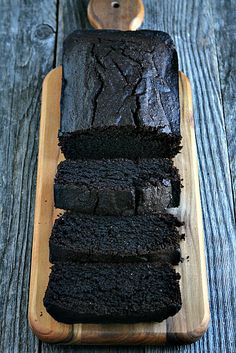 a wooden box filled with lots of black stuff