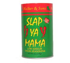 a can of slap ya mama seasoning sits on a white background with the words slap ya mama in red and green