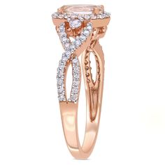 Crafted in 10K rose gold. This gorgeous ring features an oval-cut, prong-set morganite gemstone sitting at the center. With round-cut, prong-set white sapphire gemstones on either side and 66 round-cut, prong, and buttercup-set shimmering diamonds adorn the band in a unique infinity pattern. 3/4 Carat TGW Morganite and White Sapphire 1/3 Carat TW Diamond Diamond Color Rating Code: G-H Diamond Clarity Rating Code: I2-I3 Diamond Shape: Oval and Round Available in 10K Rose Gold Photo may have been enlarged or enhanced to show details. All gemstone carat weights are approximate Product Care : Simply use a tooth brush and dish soap to clean, rinsing well and letting it dry properly before use as humidity can also cause irritation. Avoid harsh chemicals or abrasives. Donâ€™t wear rings, bracelet Halo Crossover, Infinity Pattern, Rose Gold Cocktail, Wear Rings, Morganite Gemstone, Rose Gold Halo, Crossover Ring, Tooth Brush, Gold Cocktail Ring