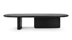 a black table sitting on top of a white floor next to a wooden table with an oval