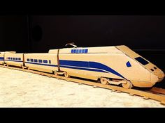 a toy train sitting on top of a wooden table