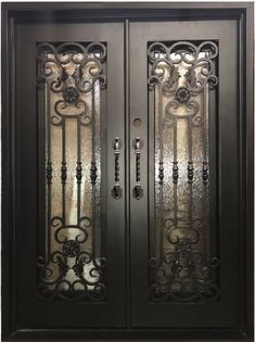 an ornate iron door with glass panels on the front and side doors, in black