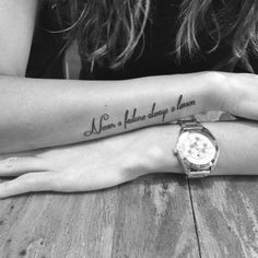 a woman's arm with a quote on it