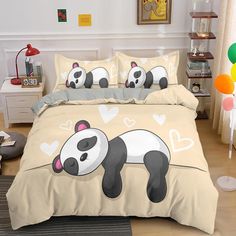 the panda bear is sleeping on the bed in the room with balloons and decorations around it