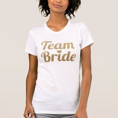 a woman wearing a white t - shirt with the word bride printed on it's chest