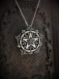 This gothic pentagram necklace is an handmade pewter sculpture with an antique finish. The Demetria 2 is a more detailed version of the Demetria 1 necklace, which is still availlable in my shop.This gothic pentagram necklace is a pendant of 3.7cm and is sold with a 18'' stainless steel chain, if you prefer a different chain lenght, you can ask for it in the comments section when ordering :)This gothic pentagram is a pewter sculpture of my own creation, i create and work the metal by myself at ho Mystical Silver Star Jewelry, Mystical Silver Star-shaped Jewelry, Spiritual Star-shaped Metal Jewelry, Gothic Oxidized Stainless Steel Necklaces, Gothic Stainless Steel Necklace With Oxidized Finish, Gothic Star-shaped Jewelry For Festivals, Gothic Star-shaped Metal Necklace, Boho Witch, Pentagram Design