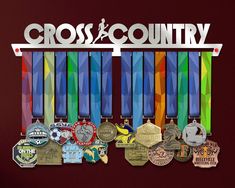 the cross country medal display has many medals on it