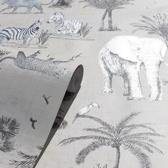 an elephant, zebras and other animals are depicted on this wallpapered room