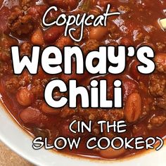 a white bowl filled with chili and meat on top of a counter next to the words, copycat wendy's chili on the slow cooker?