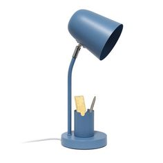 a blue desk lamp sitting on top of a table