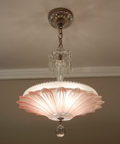 a chandelier hanging from the ceiling in a room