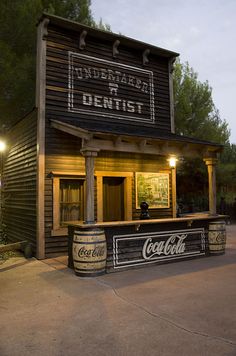 an old fashioned dentist's office with coca - cola cans on the front and side