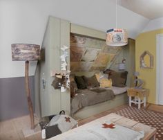 a bedroom with yellow walls and white furniture