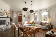 a living room filled with furniture next to a fire place in a home's fireplace