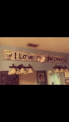 the sign above the door says i love you dearly and hanging from the ceiling