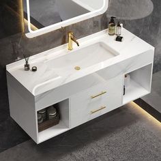 a bathroom vanity with a mirror and lights on the wall next to it is shown