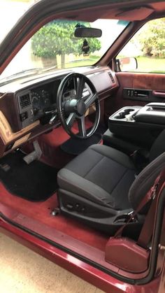 the interior of a car with its door open