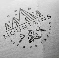 the logo for mountains brewing is printed on white paper with black ink and features an image of a mountain