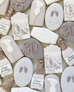 decorated cookies with the number 30 and wine glasses on them for 30th birthday party favors