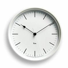 a white clock with black hands on a white background