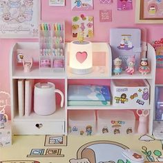 there is a doll house with many items on the shelves