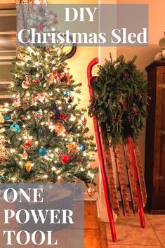 a small christmas tree sitting next to a wooden sled