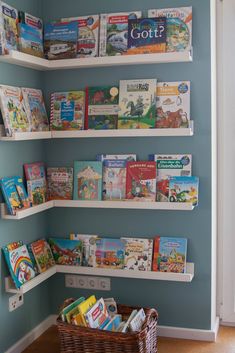 the bookshelves are filled with children's books