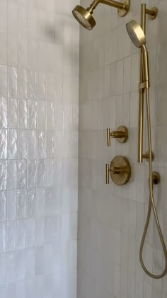 the shower head and handset are gold in color