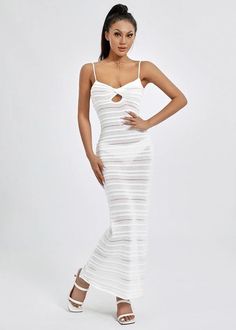 Expertly crafted for comfort and style, our Striped Knitted Cami Maxi Dress is a must-have addition to any wardrobe. With its timeless striped pattern and lightweight fabric, this dress is perfect for any occasion. Its classic white color adds a touch of elegance, making it a versatile and chic choice for any fashion-forward individual. Fabric: High Stretch Material: Polyester Fiber Elegant Knit Midi Dress For Vacation, White Knit Maxi Dress For Vacation, Chic White Ribbed Midi Dress, White Knit Maxi Dress For Beach, White Ribbed Summer Dress, White Ribbed Knit Dress, Elegant Knit Maxi Dress For Day Out, Elegant Knit Midi Dress For Day Out, Spring White Ribbed Midi Dress