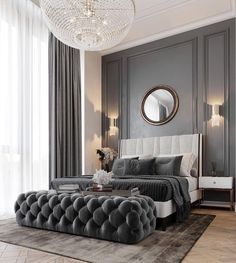 an elegant bedroom with gray walls and grey bedding, chandelier, round mirror on the wall